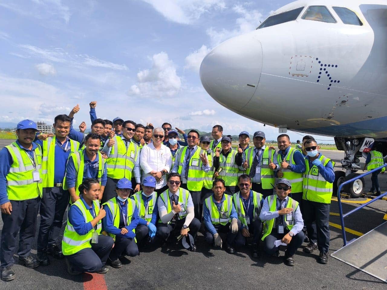 With ground staff at Imphal airport
